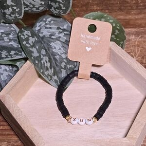 Handmade Black Bracelet with Gold Accents